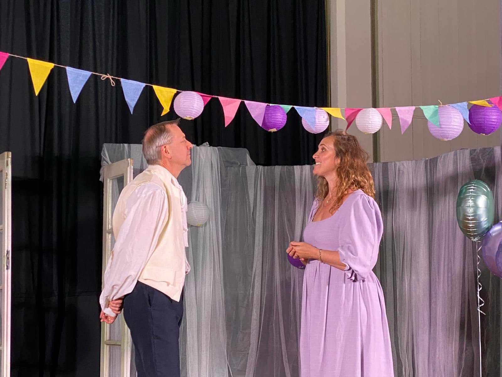Much Ado About Nothing on stage under the bunting