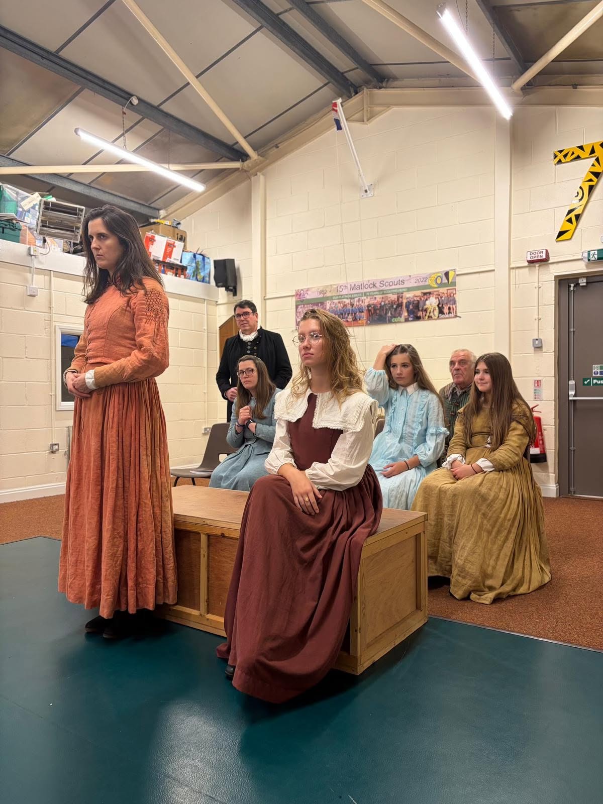 The Crucible rehearsal with the company seated behind the scene