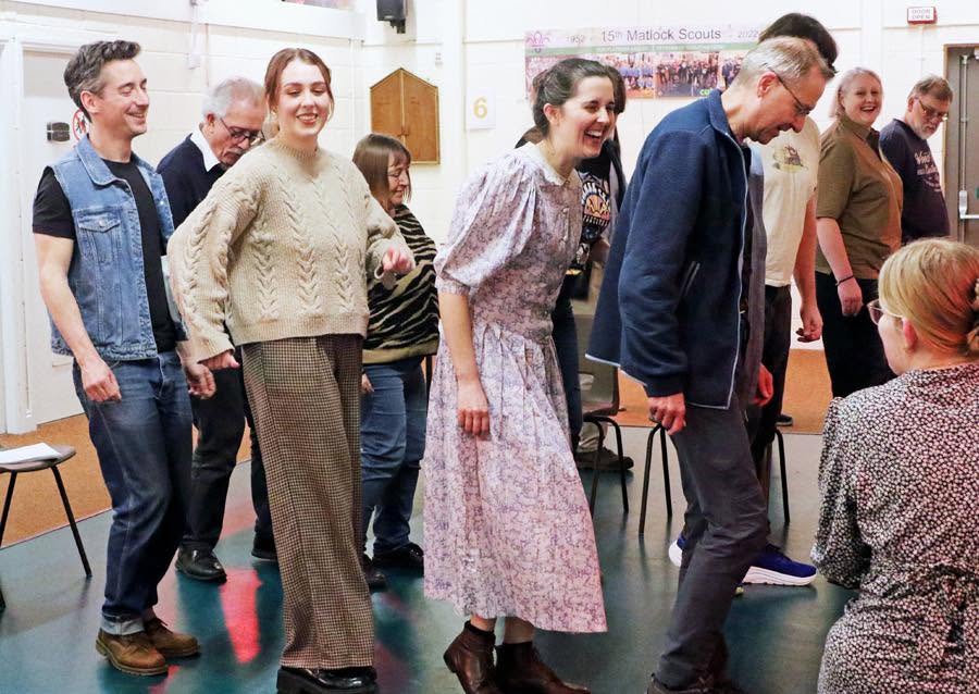 The As You Like It company sharing a laugh in rehearsal